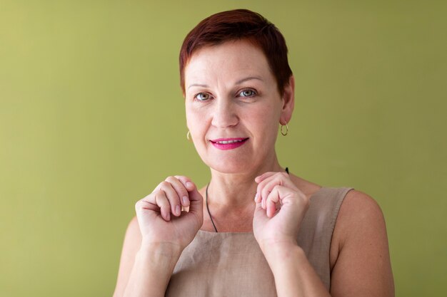 Mature woman with short hair looking at camera