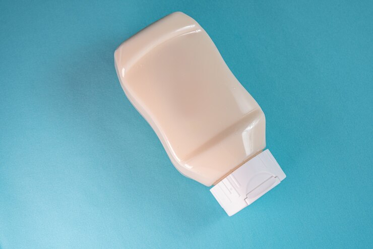Free Photo mayonnaise can on the blue surface