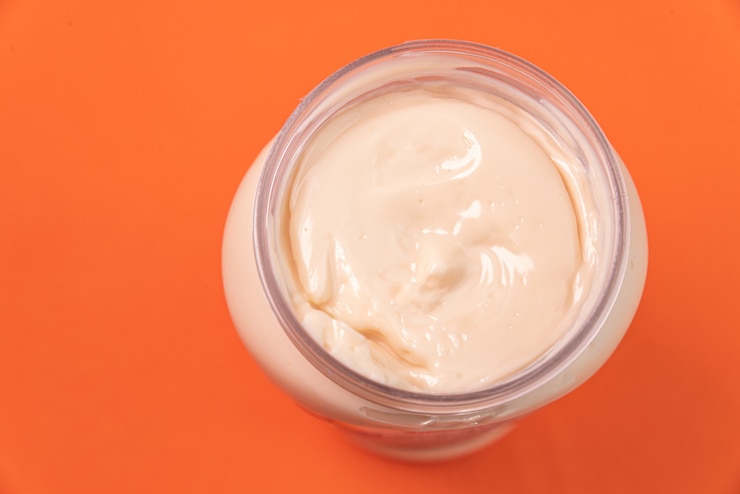 Free Photo mayonnaise can on the orange background