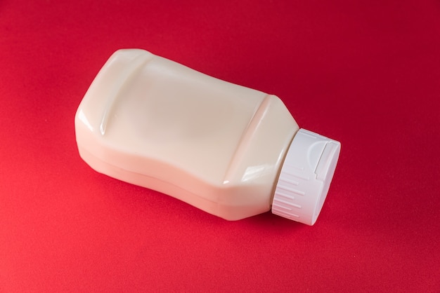 Mayonnaise can on the red background