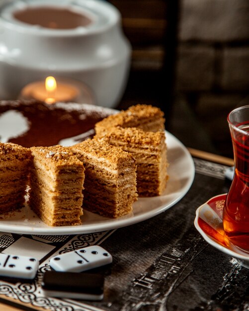 Mead pie sliced into a pieces and a black tea