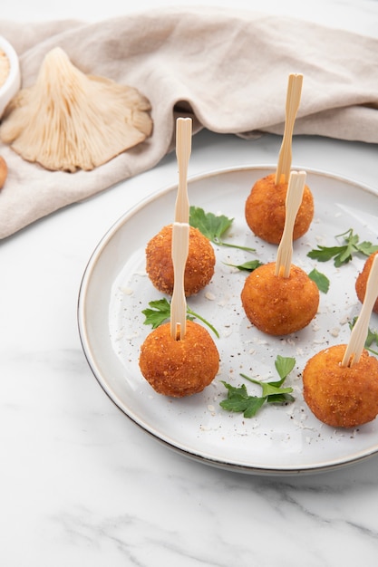 Meal containing croquettes and parsley