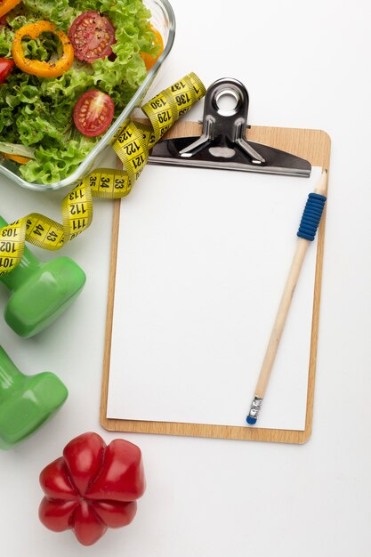 meal planning clipboard and food assortment