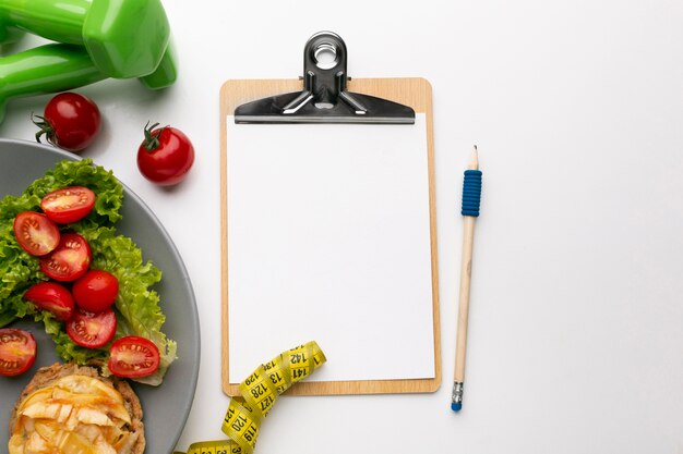 Meal planning clipboard and food assortment