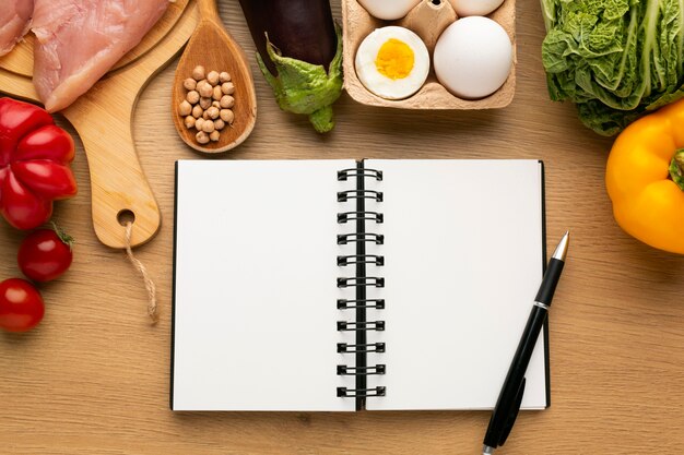 Meal planning notepad and food arrangement