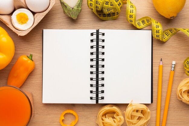 Meal planning notepad and food arrangement