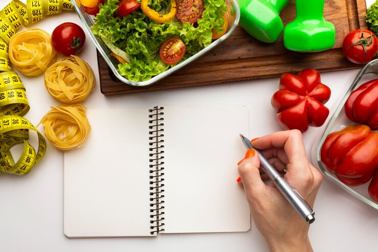 Free Photo meal planning notepad and food composition