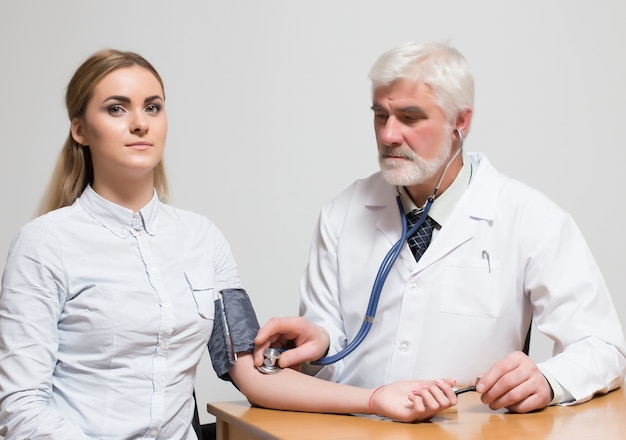 measuring arm smile two closeup stethoscope