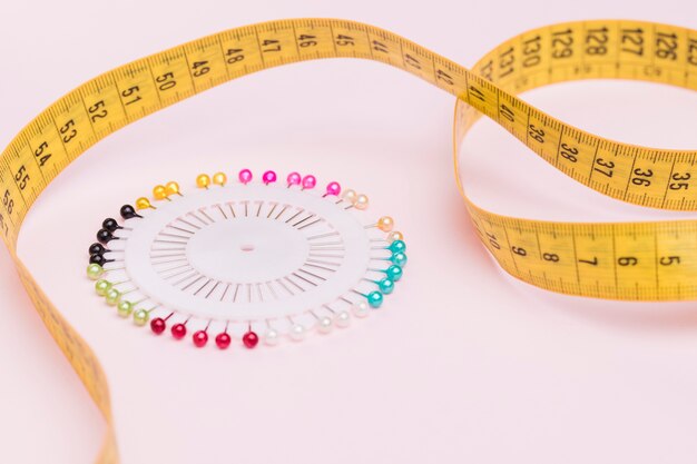 Measuring tape with colorful needles