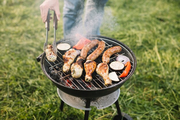 Meat on barbecue grill in nature