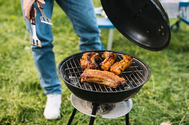 Meat on barbecue grill in nature