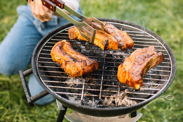 Meat on barbecue grill in nature