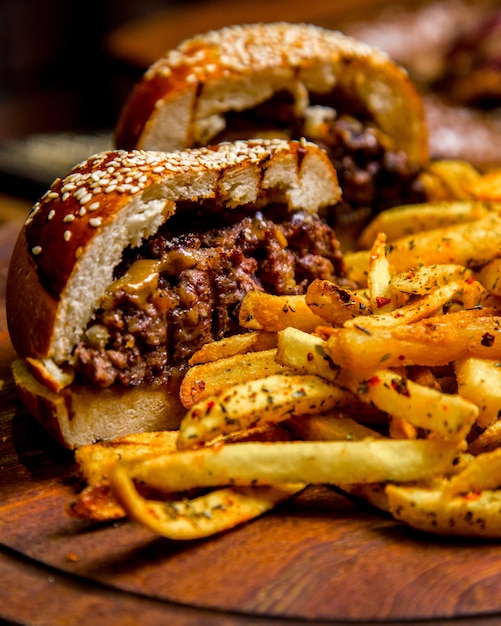 Meat burger french fries side view