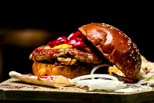 Meat burger tomato onion beans walnuts side view