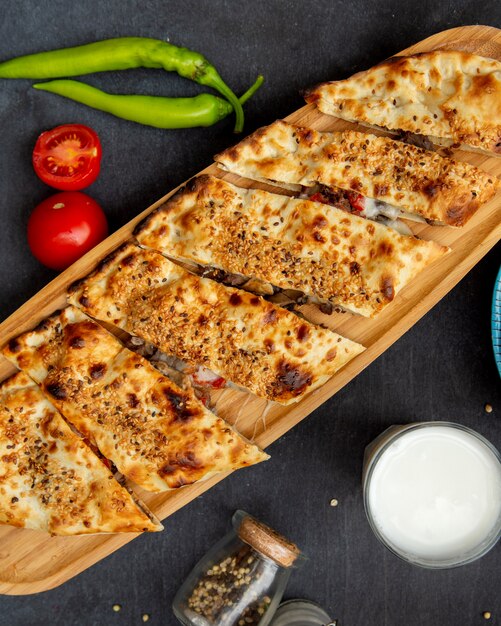 Meat and cheese casserole served on desk