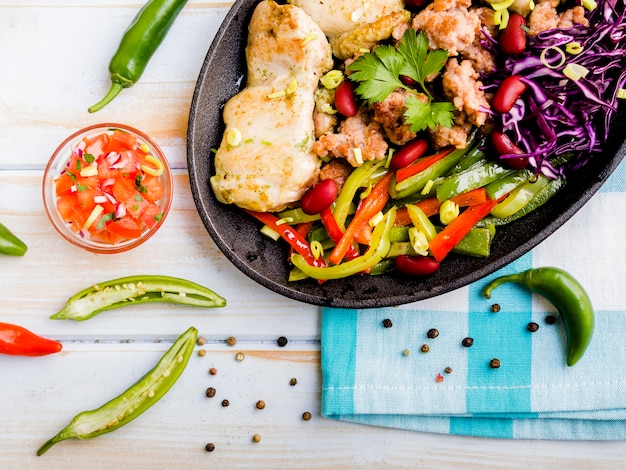 Meat dish with vegetables near garnish