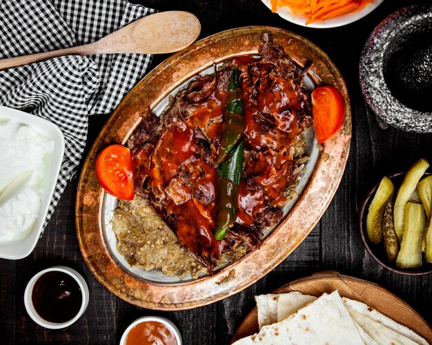 meat doner with eggplant pure on the table