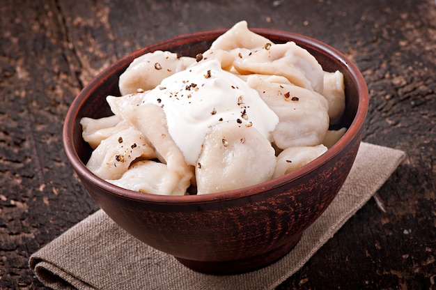 Free photo meat dumplings - russian boiled pelmeni in plate