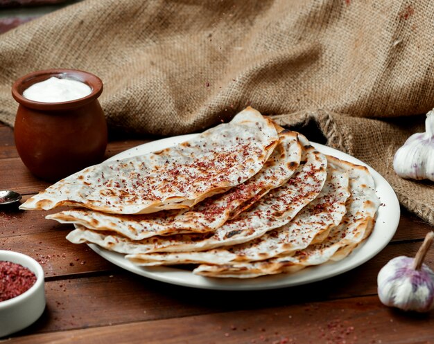 Meat gutabs with sumakh and yogurt