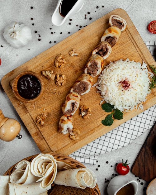 meat rolls served with rice