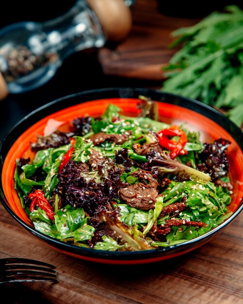 Meat salad with vegetables on the table