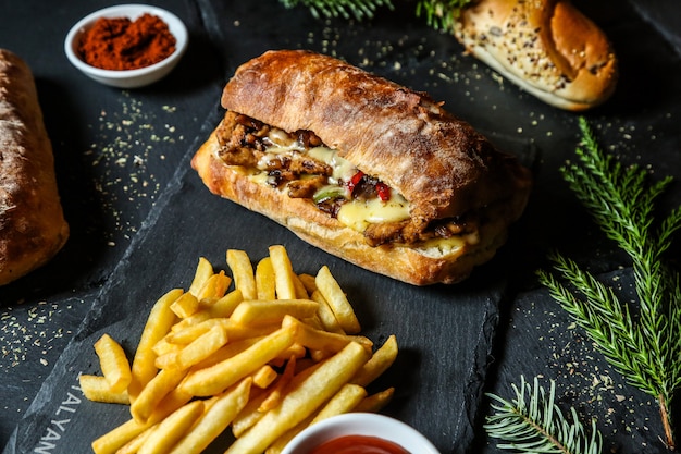 Meat sandwith served with french fries