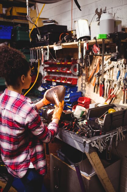 Mechanic examining a bicycle seat