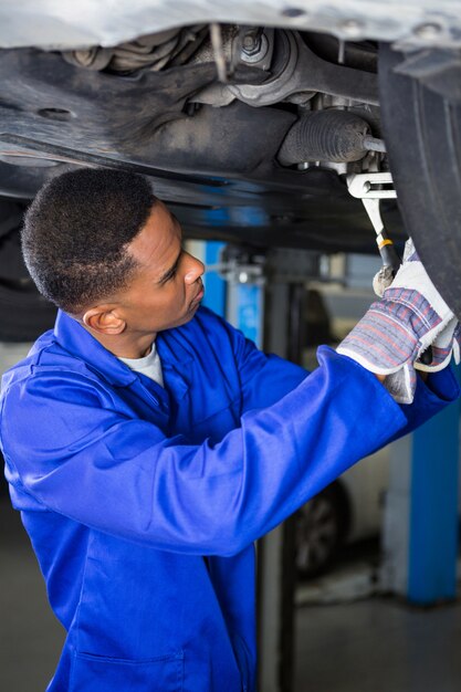 Mechanic fixing a car tyre