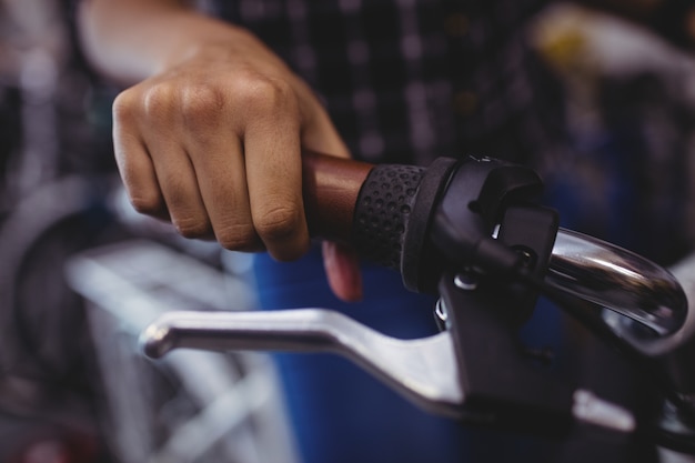 Mechanic holding a bicycle handlebar