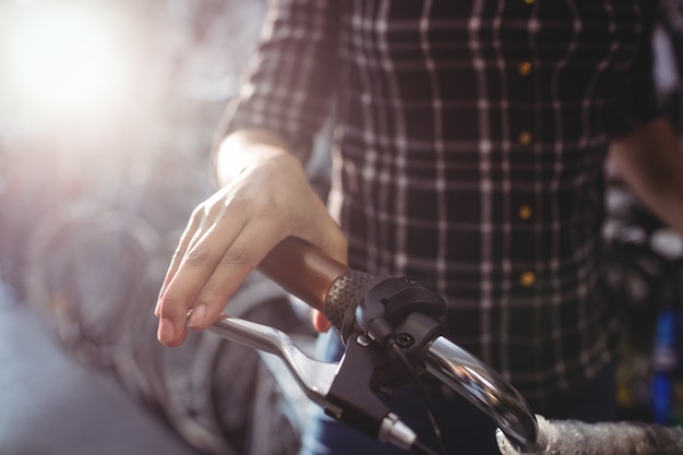 Mechanic holding a bicycle handlebar