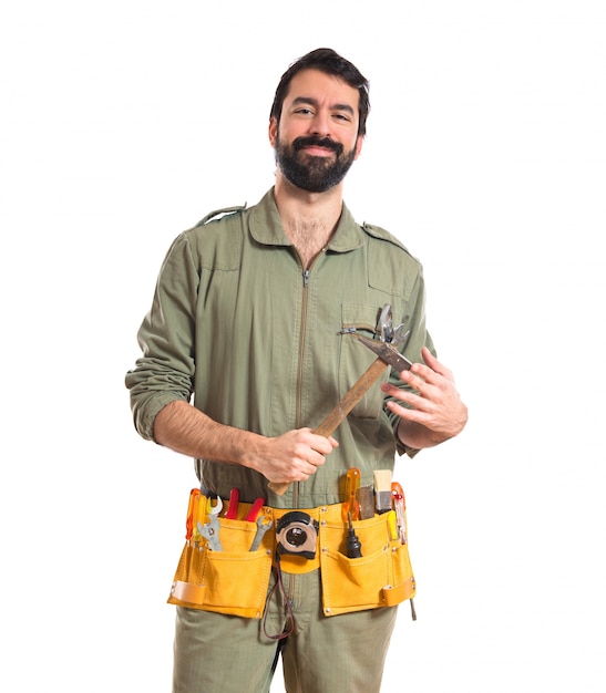 Free photo mechanic holding a hammer