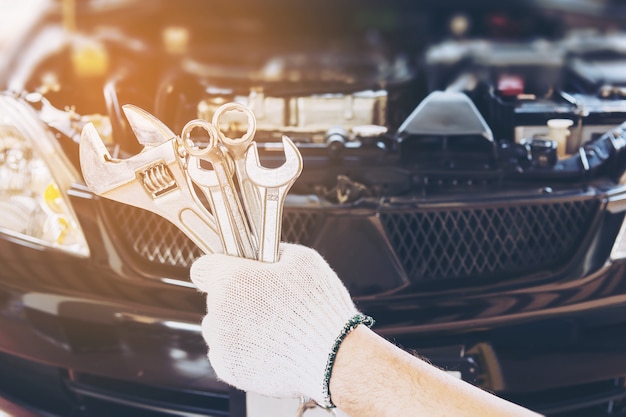 Free photo mechanic man repairing car