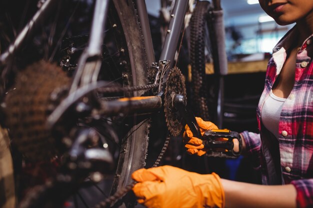 Mechanic repairing a bicycle