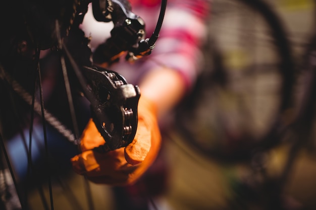 Mechanic repairing a bicycle