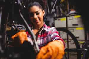 Free photo mechanic repairing a bicycle