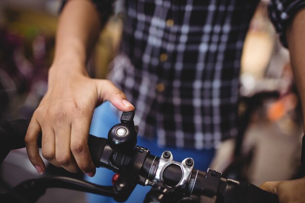 Mechanic ringing a bicycle bell