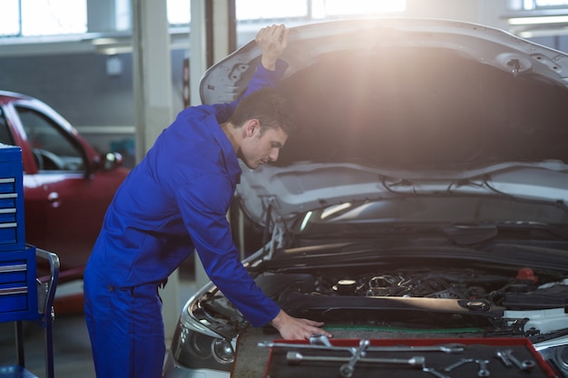 Mechanic servicing a car engine