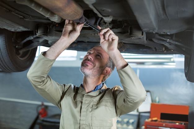 Mechanic servicing a car