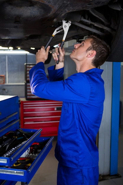 Mechanic servicing a car