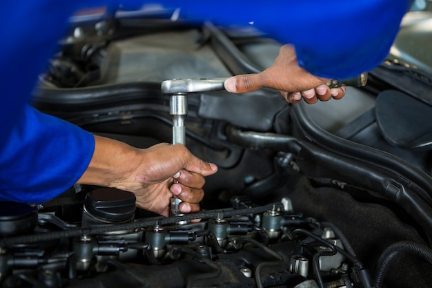 Mechanic servicing a car