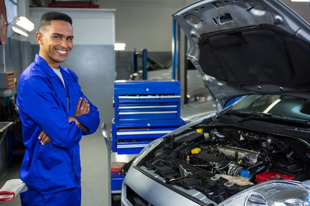 Mechanic standing at repair garage