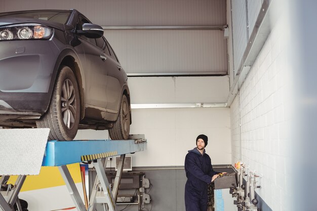 Mechanic using control box