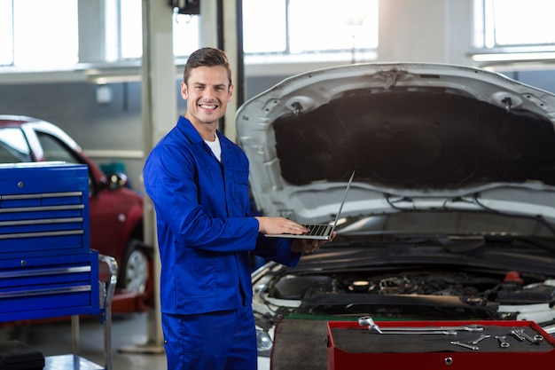 Mechanic using laptop