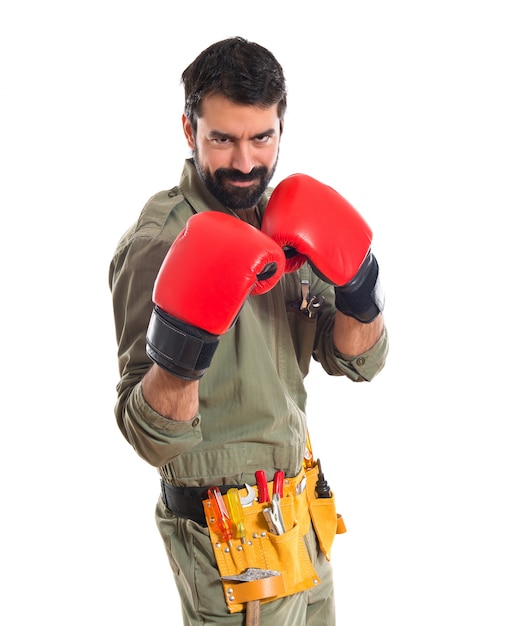 Free photo mechanic with boxing gloves