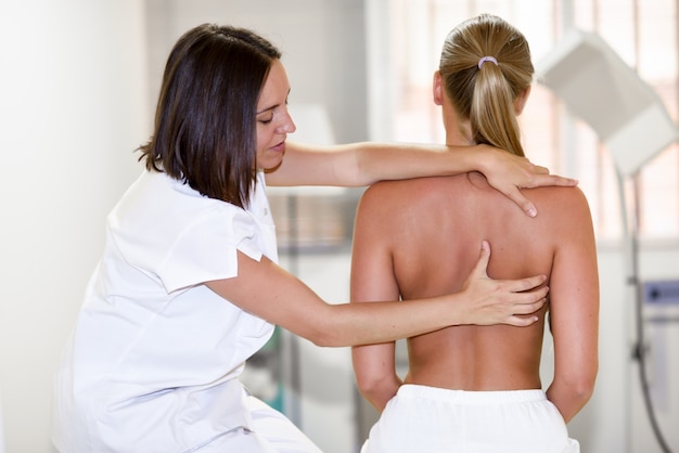Medical check at the shoulder in a physiotherapy center.