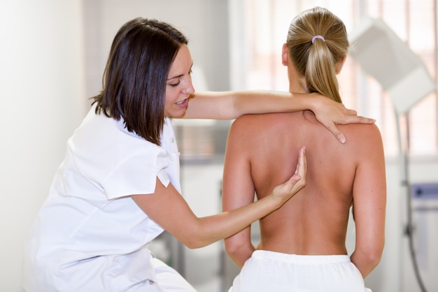 Medical check at the shoulder in a physiotherapy center.