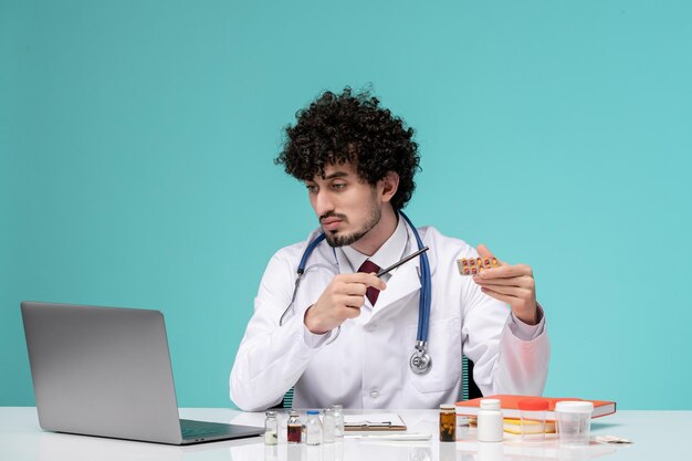 Medical cute handsome doctor working on computer remotely in lab coat explaining instruction