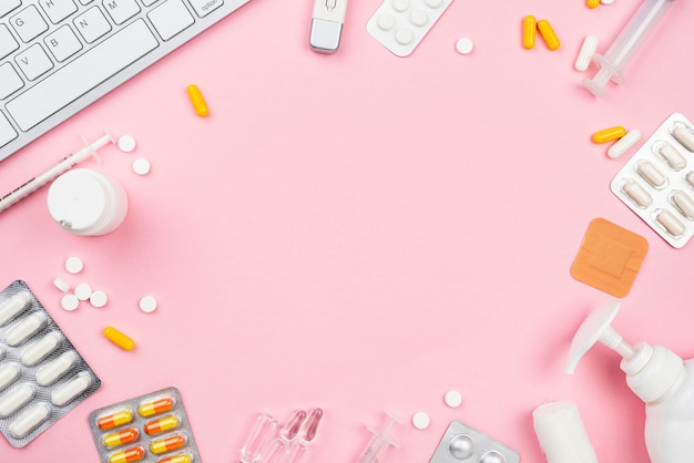 Medical desk arrangement on pink background