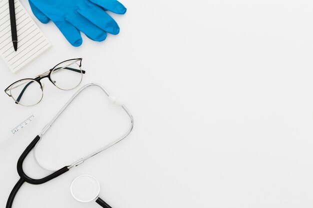 Medical desk with stethoscope and gloves