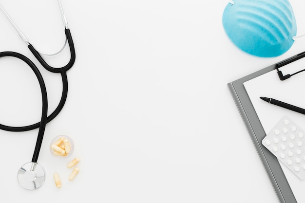 Medical desk with stethoscope and mask